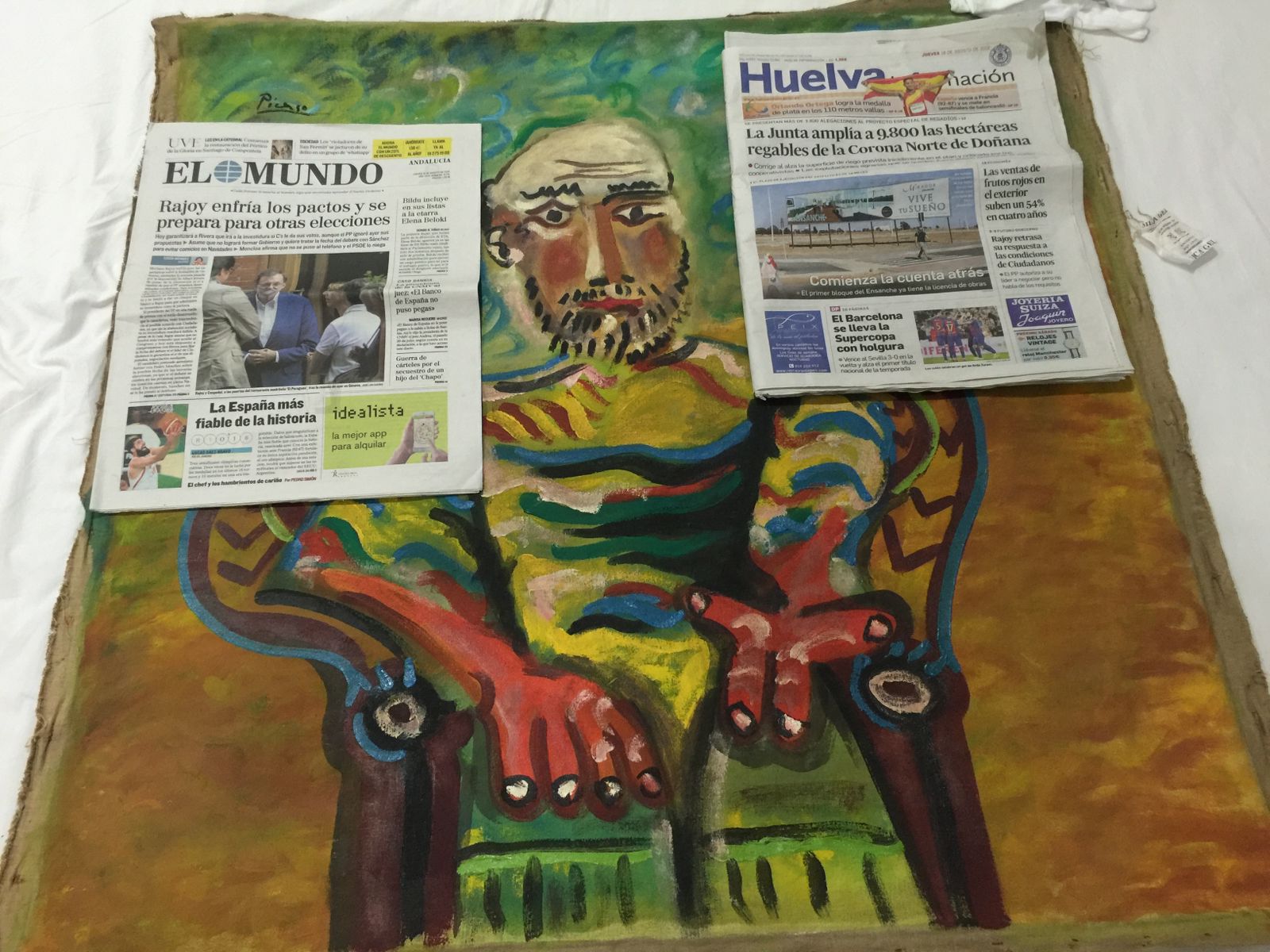 Cuadro El Hombre Sentado y los diarios del día en España (2024)